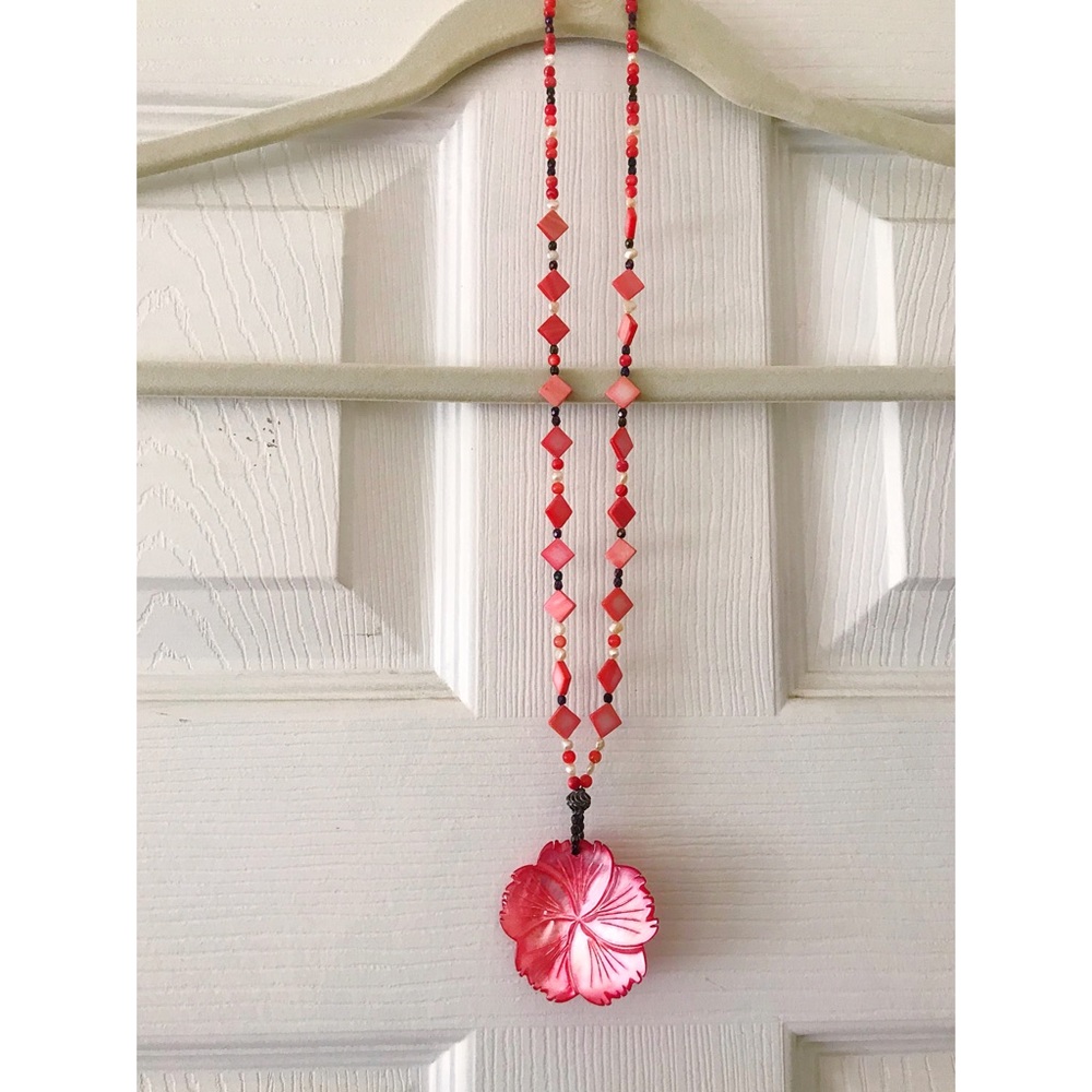 Pink flower necklace.